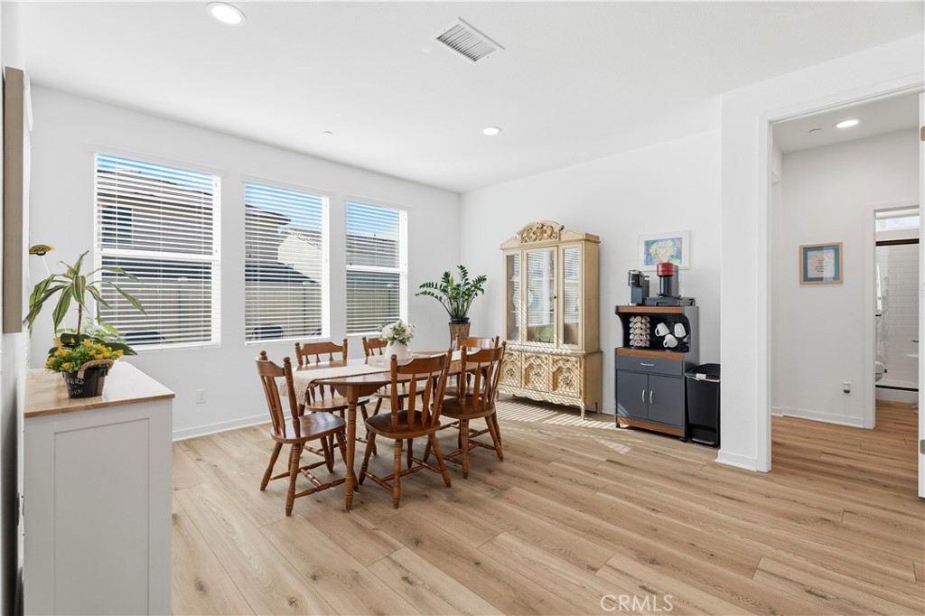 18100 Tableau Way Saugus, CA 91350 - Photo 21 of 63 a dining room with furniture and wooden floor
