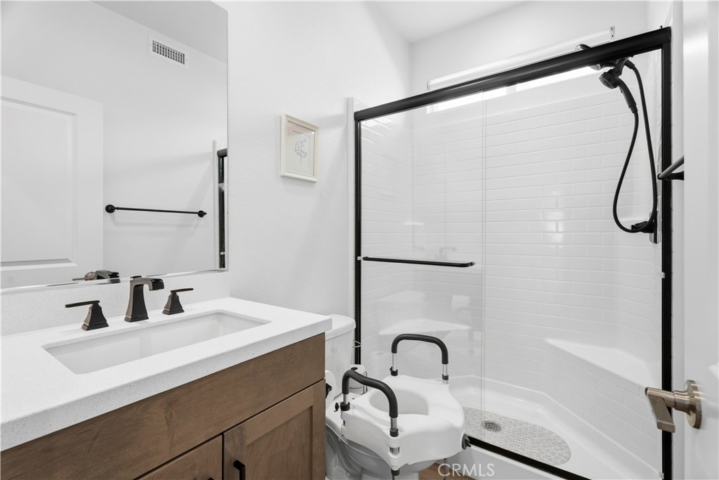 18100 Tableau Way Saugus, CA 91350 - Photo 23 of 63 a bathroom with a sink and a mirror