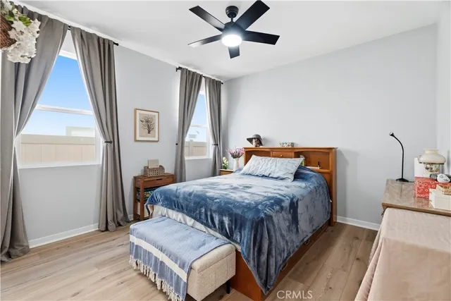 a spacious bedroom with a bed and window