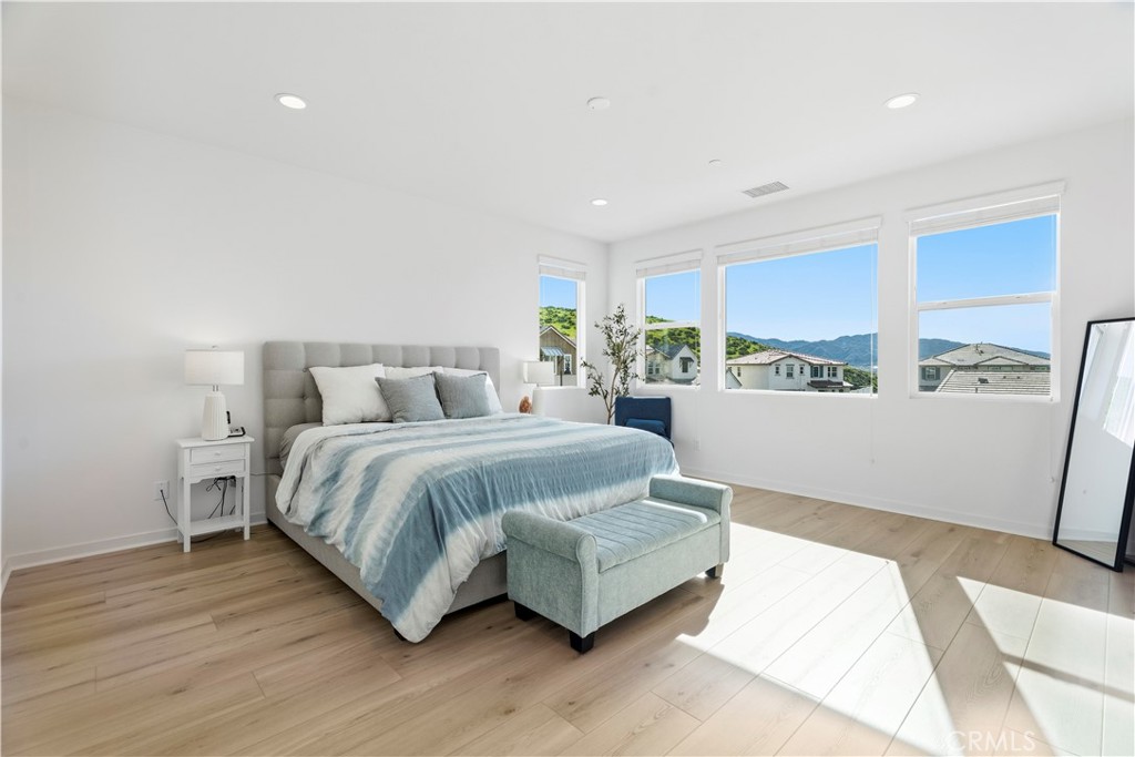 18100 Tableau Way Saugus, CA 91350 - Photo 29 of 63 a spacious bedroom with a bed and window