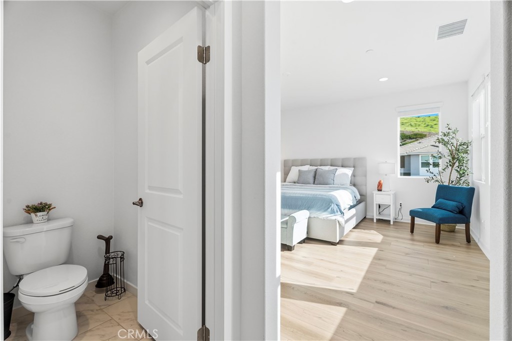18100 Tableau Way Saugus, CA 91350 - Photo 30 of 63 a bathroom with a toilet and a view of bathroom