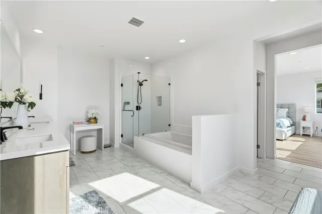 a bedroom with a bed a desk and chair