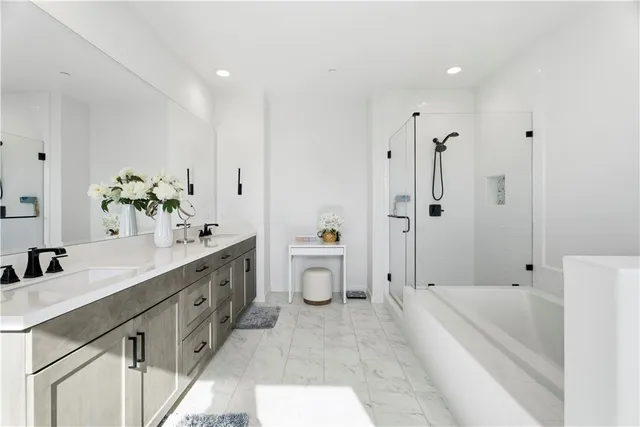 a bathroom with a sink mirror vanity and toilet