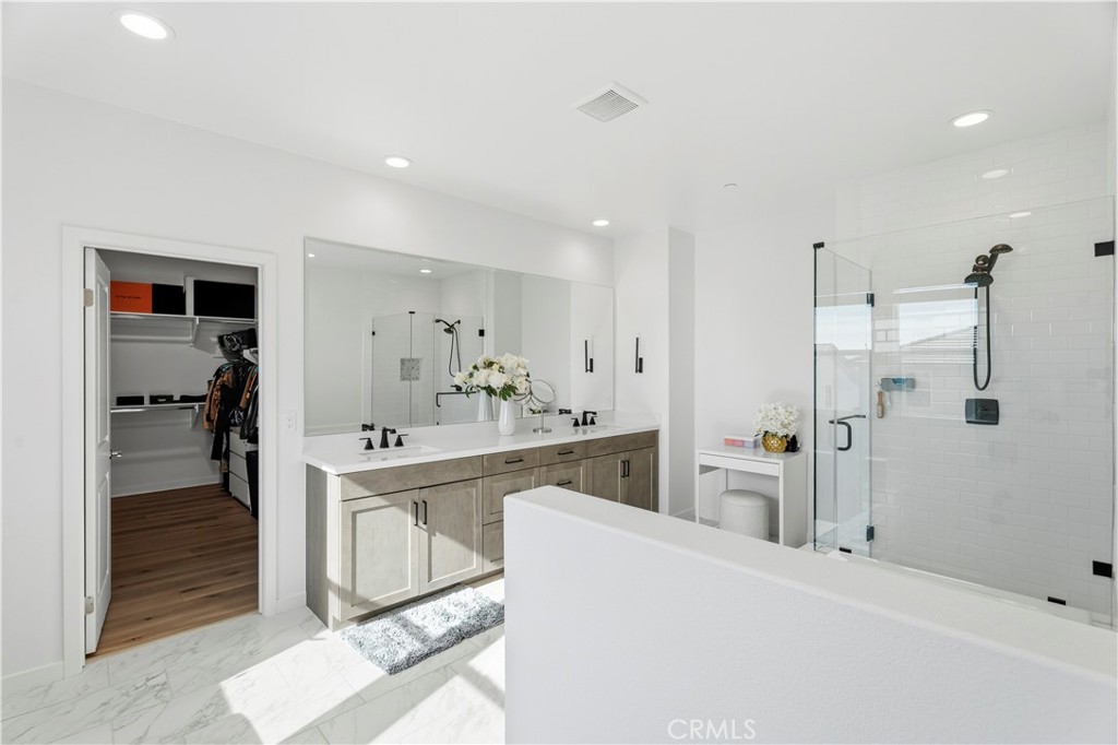 18100 Tableau Way Saugus, CA 91350 - Photo 33 of 63 a large white kitchen with a sink and a refrigerator