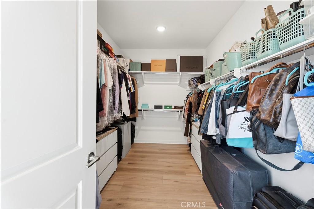 18100 Tableau Way Saugus, CA 91350 - Photo 34 of 63 a walk in closet with wooden floor