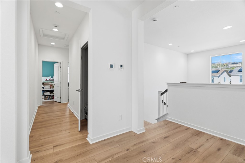 18100 Tableau Way Saugus, CA 91350 - Photo 35 of 63 a view of a hallway with wooden floor and closet