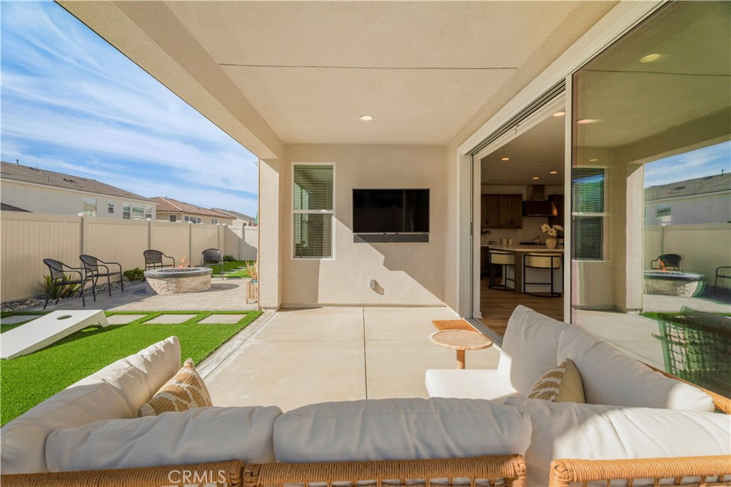 18100 Tableau Way Saugus, CA 91350 - Photo 45 of 63 a view of a living room and kitchen floor to ceiling window and kitchen view