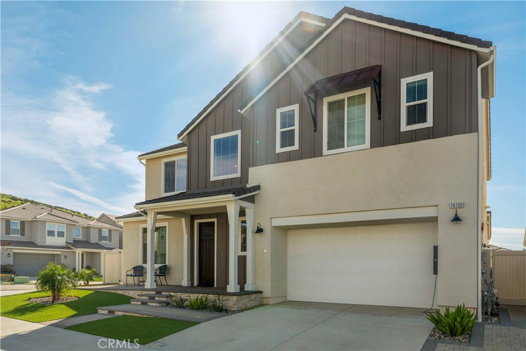 18100 Tableau Way Saugus, CA 91350 - Photo 47 of 63 a front view of a house with garden