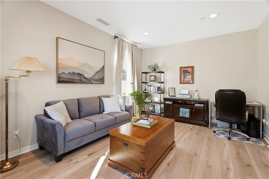 18100 Tableau Way Saugus, CA 91350 - Photo 6 of 63 a living room with furniture and wooden floor