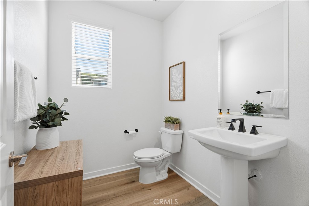 18100 Tableau Way Saugus, CA 91350 - Photo 7 of 63 a bathroom with a sink toilet and a mirror