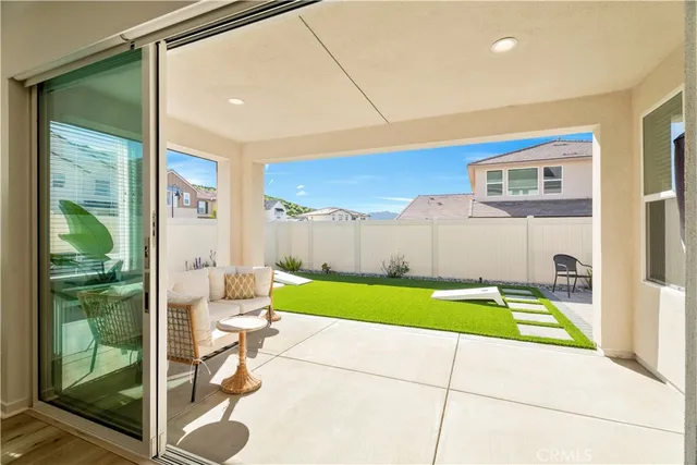 a kitchen with a sink cabinets and wooden floor