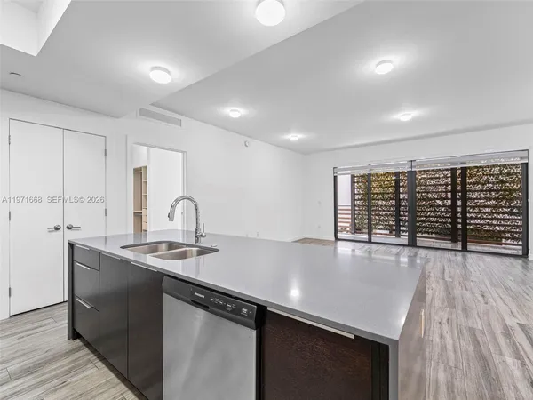 an empty room with wooden floor