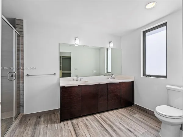 a bathroom with a sink and mirror
