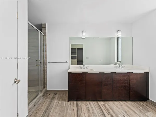 a bathroom with a sink and mirror