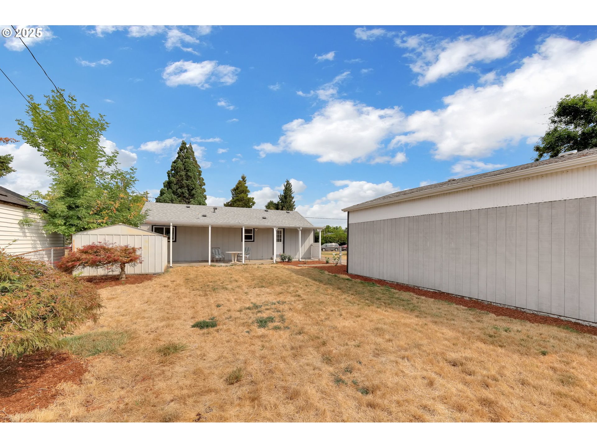 2665 E Street Springfield, OR 97477 - Photo 29 of 37 a view of a house with a patio
