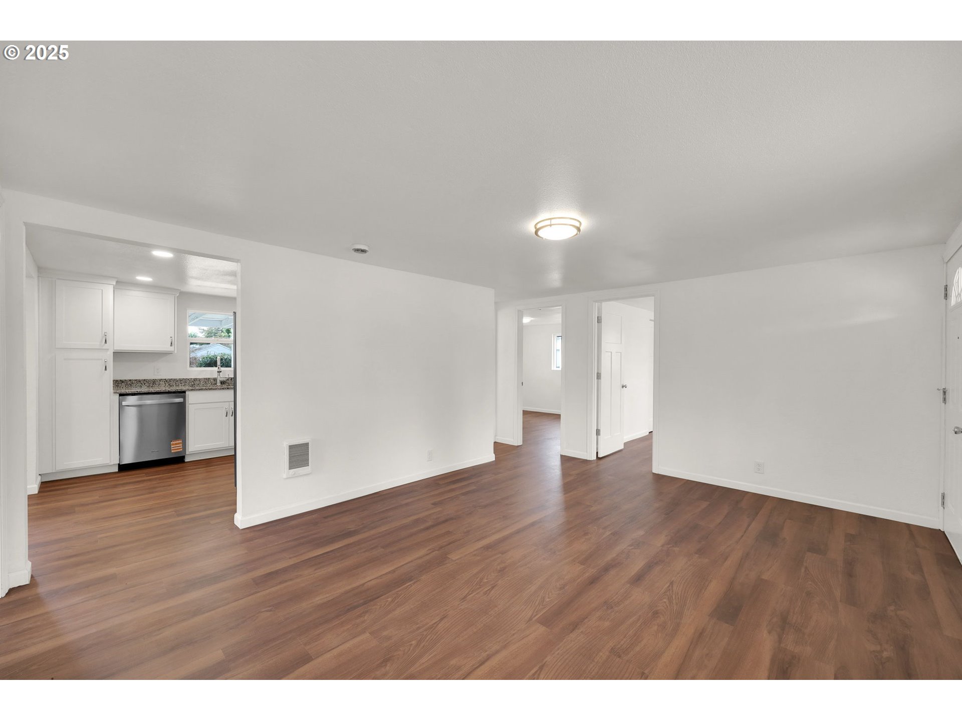 2665 E Street Springfield, OR 97477 - Photo 7 of 37 a view of a kitchen with wooden floor and a sink