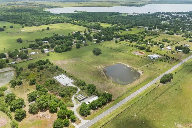 a view of a lake with a yard