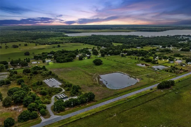 a view of a garden with an outdoor seating