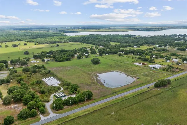 an aerial view of a golf course with parking space