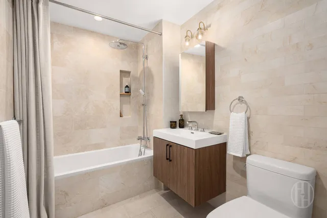 a balcony view with a couple of chairs and a large window