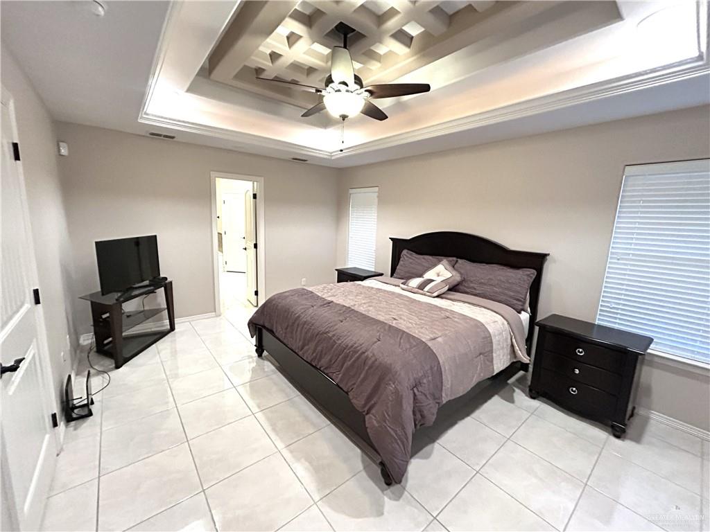 2111 Solar Drive Mission, TX 78574 - Photo 14 of 20 a bedroom with a bed mirror and couch