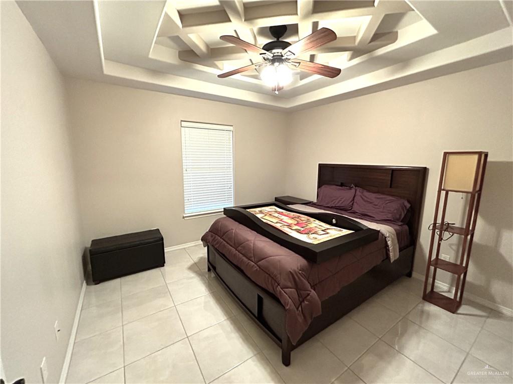 2111 Solar Drive Mission, TX 78574 - Photo 9 of 20 a bedroom with a bed and a chair