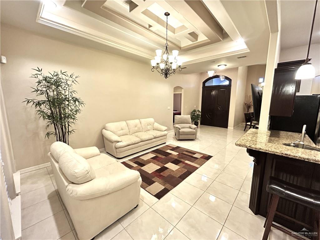 2111 Solar Drive Mission, TX 78574 - Photo 10 of 20 a living room with furniture and a chandelier