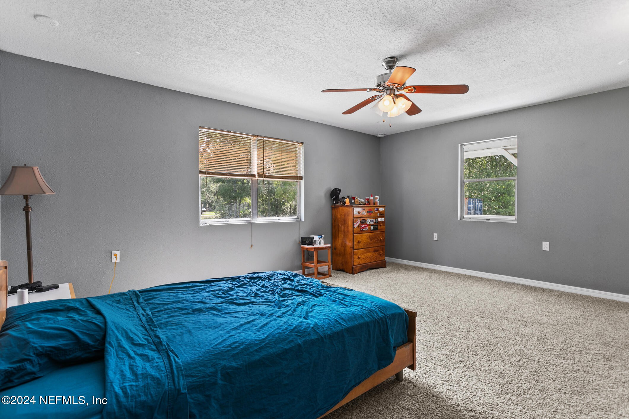 1151 Carter Road Lawtey, FL 32058 - Photo 21 of 47 a bedroom with a bed and a chandelier