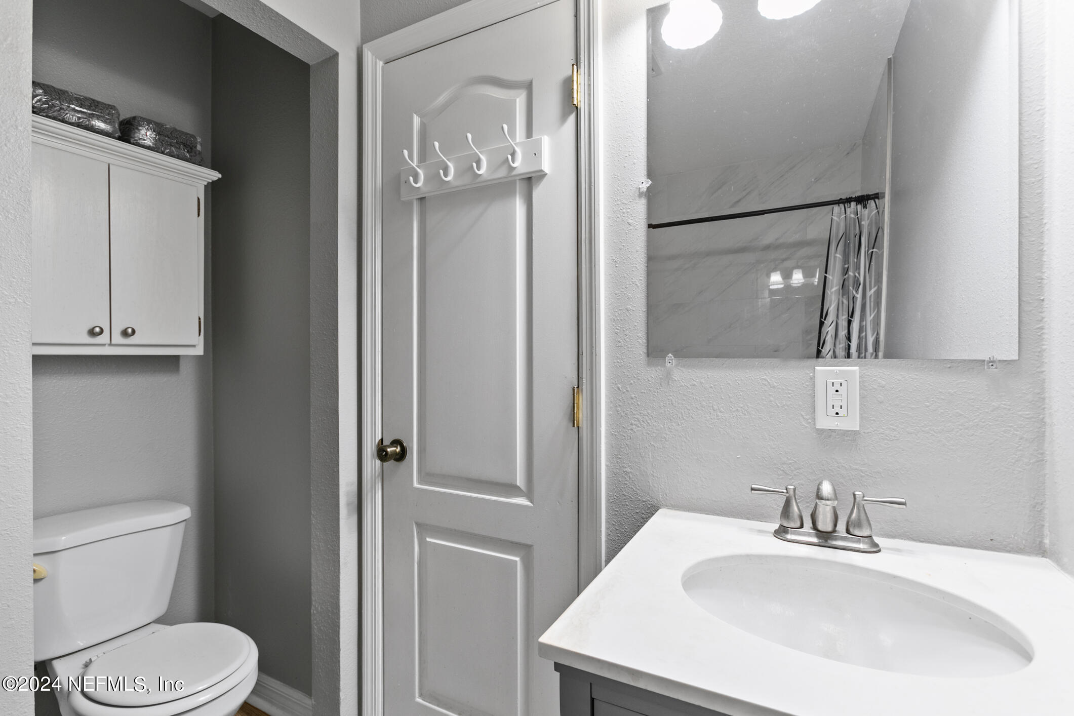 1151 Carter Road Lawtey, FL 32058 - Photo 26 of 47 a bathroom with a sink a toilet and shower