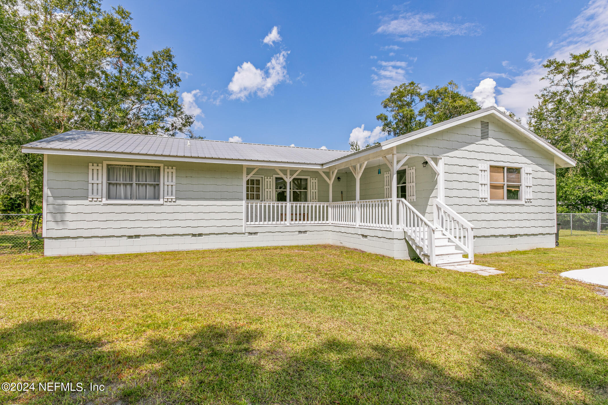 1151 Carter Road Lawtey, FL 32058 - Photo 4 of 47 a house view with swimming pool in front of it