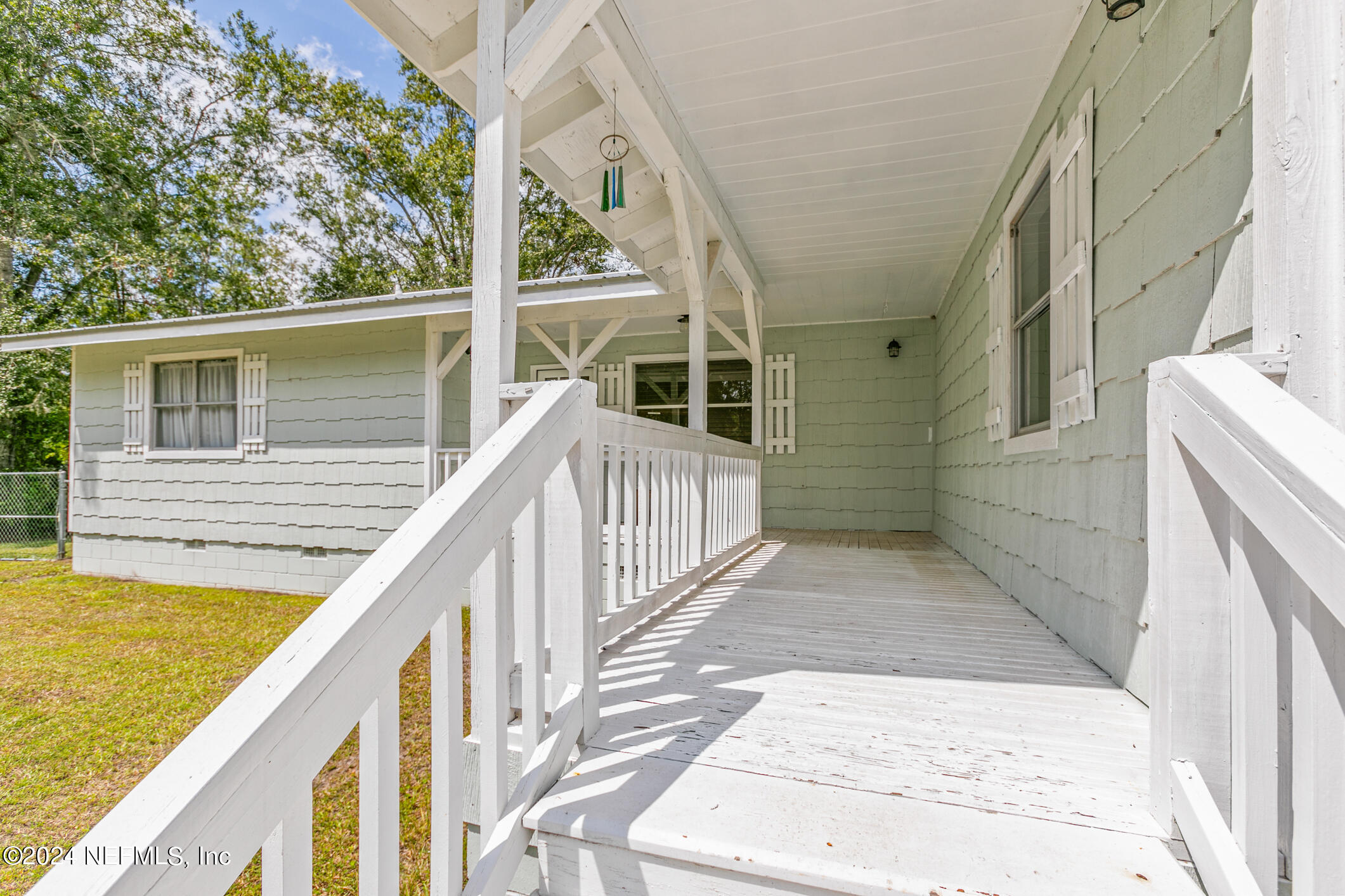 1151 Carter Road Lawtey, FL 32058 - Photo 7 of 47 a view of deck with large trees and wooden floor
