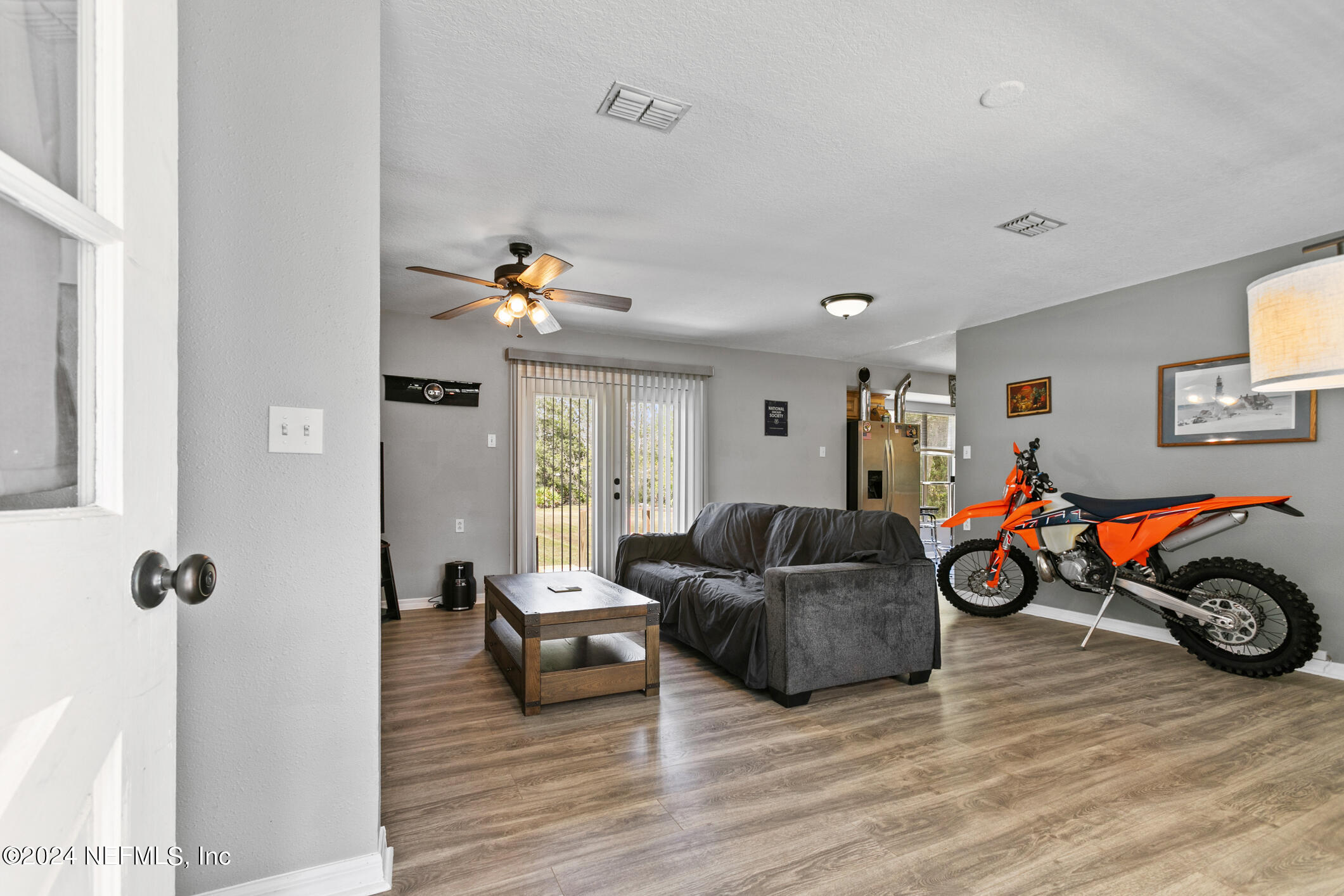 1151 Carter Road Lawtey, FL 32058 - Photo 9 of 47 a living room with furniture and a wooden floor