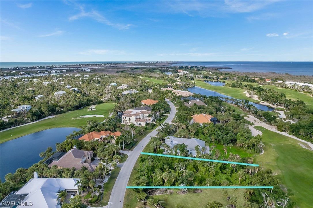 2438 Wulfert Road Sanibel, FL 33957 - Photo 11 of 21 an aerial view of ocean and residential houses with outdoor space