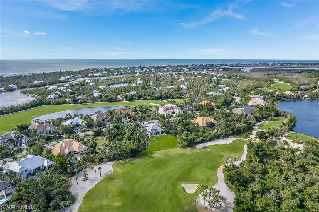 2438 Wulfert Road Sanibel, FL 33957 - Photo 13 of 21 an aerial view of a city with lots of residential buildings and mountain view in back