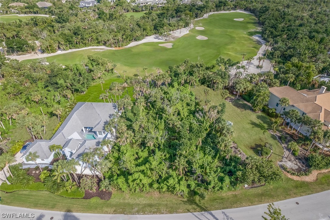 2438 Wulfert Road Sanibel, FL 33957 - Photo 18 of 21 an aerial view of a residential houses with outdoor space and trees all around