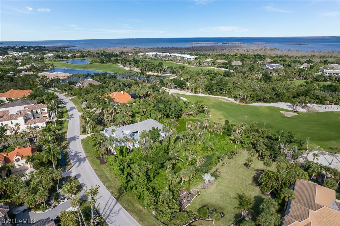 2438 Wulfert Road Sanibel, FL 33957 - Photo 19 of 21 an aerial view of residential houses with outdoor space and trees