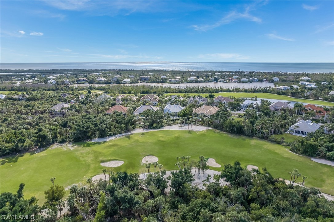 2438 Wulfert Road Sanibel, FL 33957 - Photo 20 of 21 an aerial view of a residential houses with outdoor space and trees