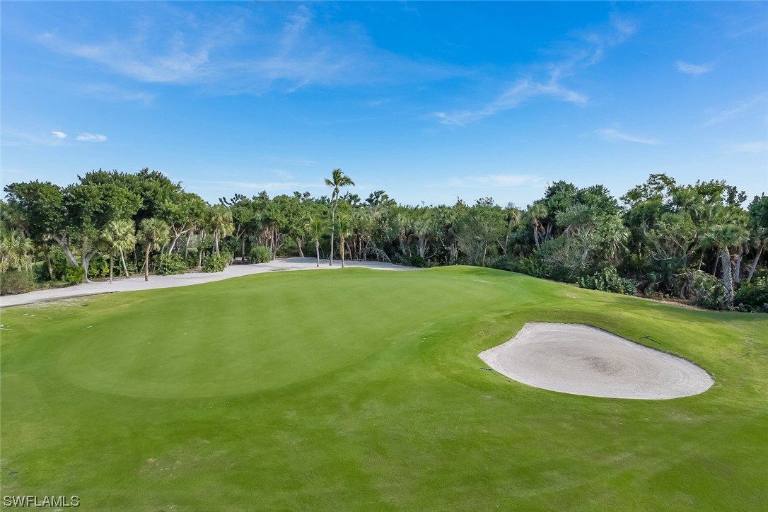 2438 Wulfert Road Sanibel, FL 33957 - Photo 3 of 21 a view of a golf course with a garden