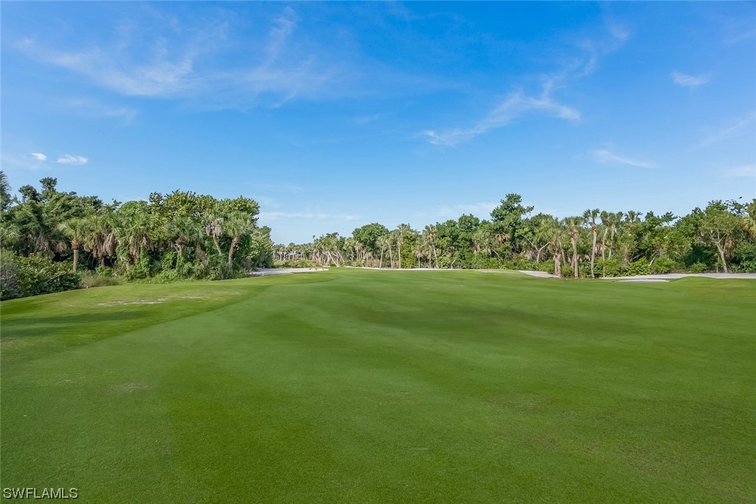 2438 Wulfert Road Sanibel, FL 33957 - Photo 7 of 21 a view of green field with trees in the background