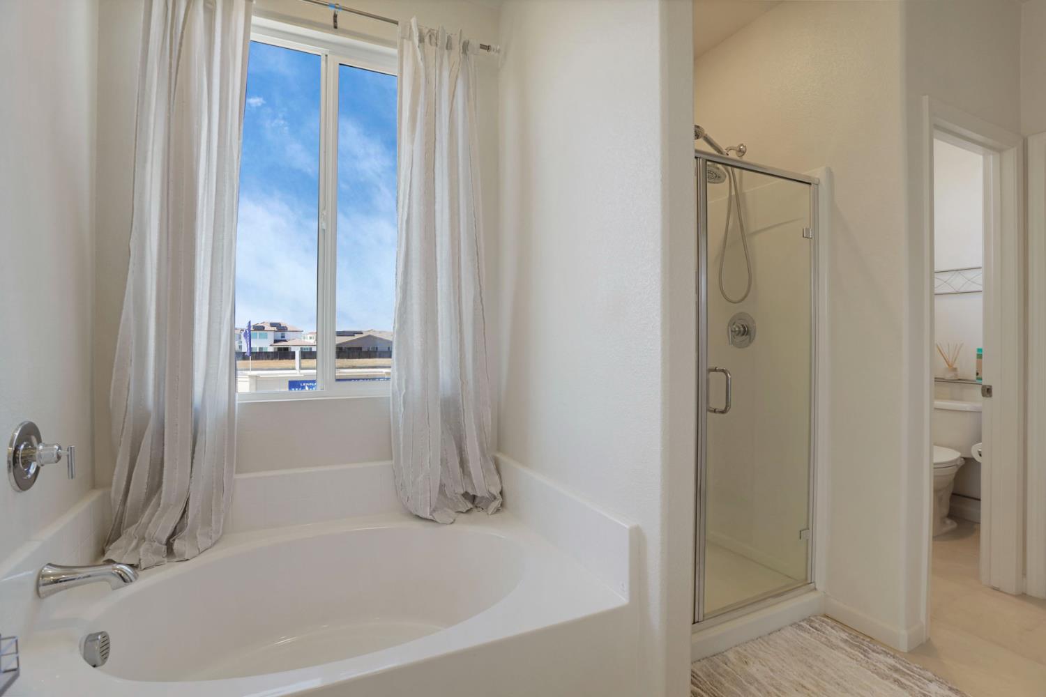 6949 Foraker Drive Stockton, CA 95219 - Photo 28 of 34 a white bath tub sitting next to a white sink