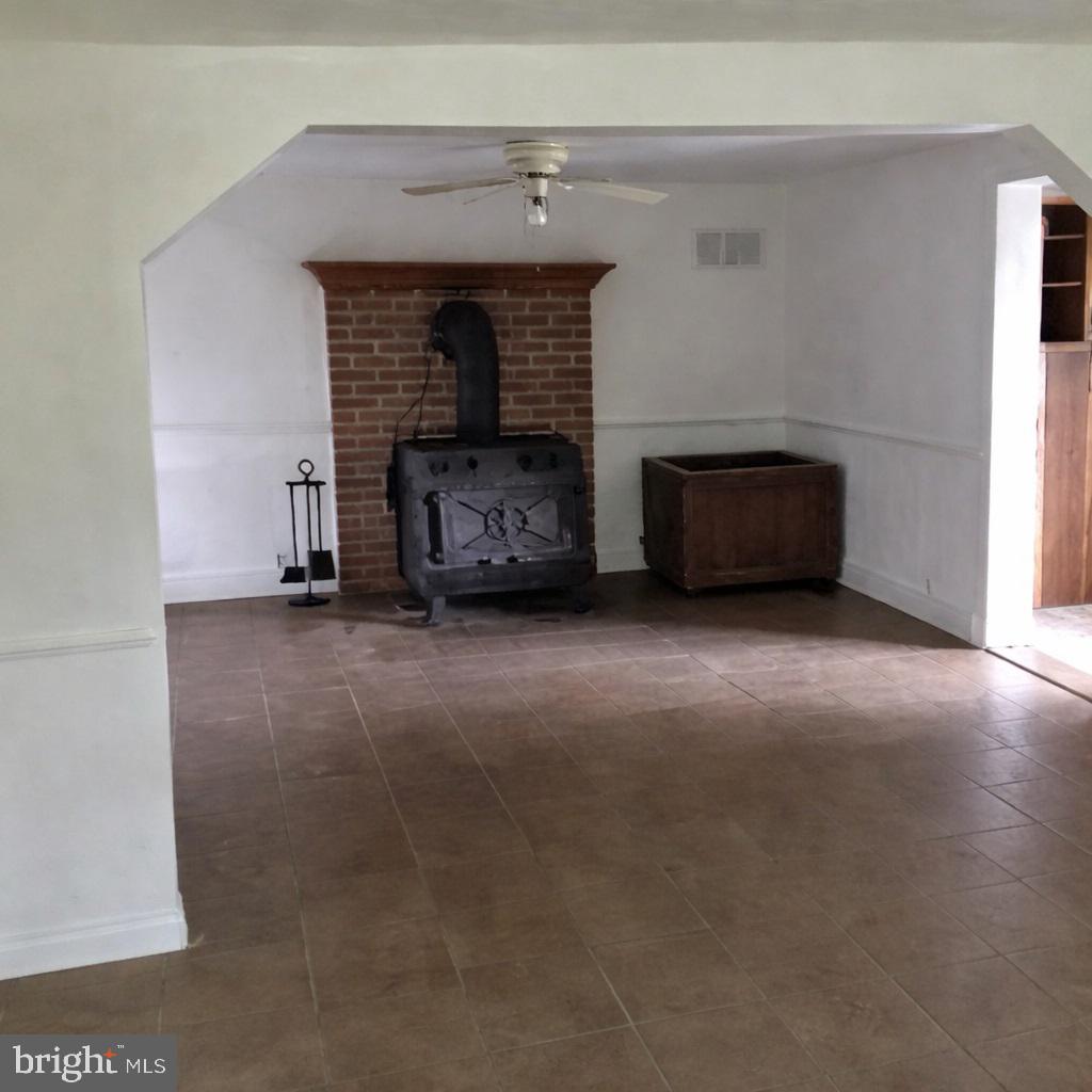 2906 Needmore Road Baker, WV 26801 - Photo 15 of 22 a living room with furniture and a fireplace