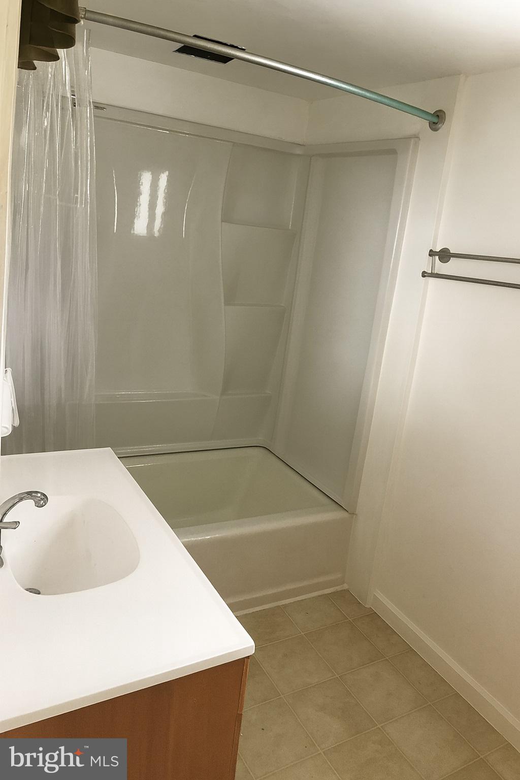 2906 Needmore Road Baker, WV 26801 - Photo 17 of 22 a bathroom with a bathtub and a sink