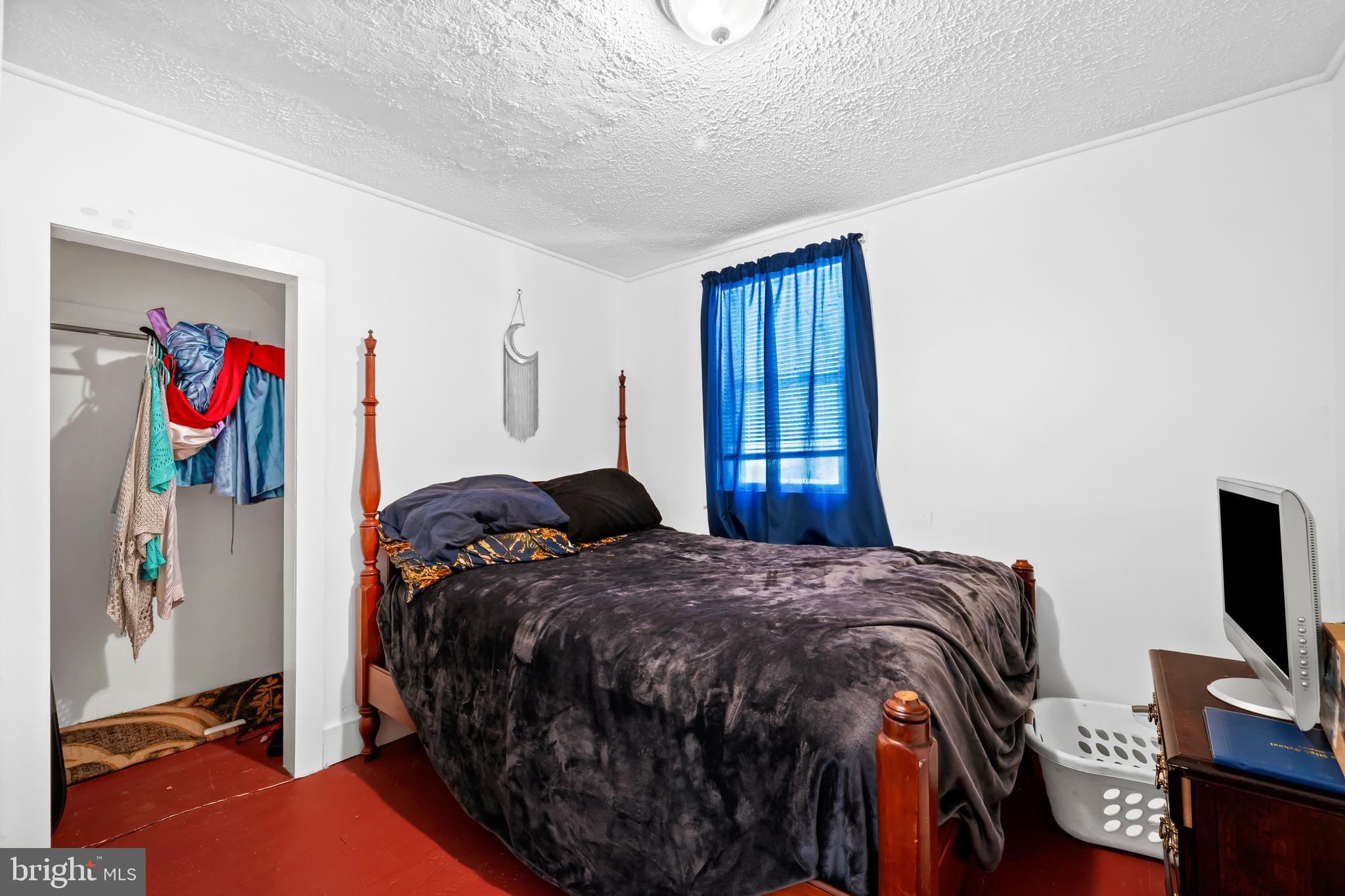 2906 Needmore Road Baker, WV 26801 - Photo 20 of 22 a bedroom with a bed and a flat screen tv