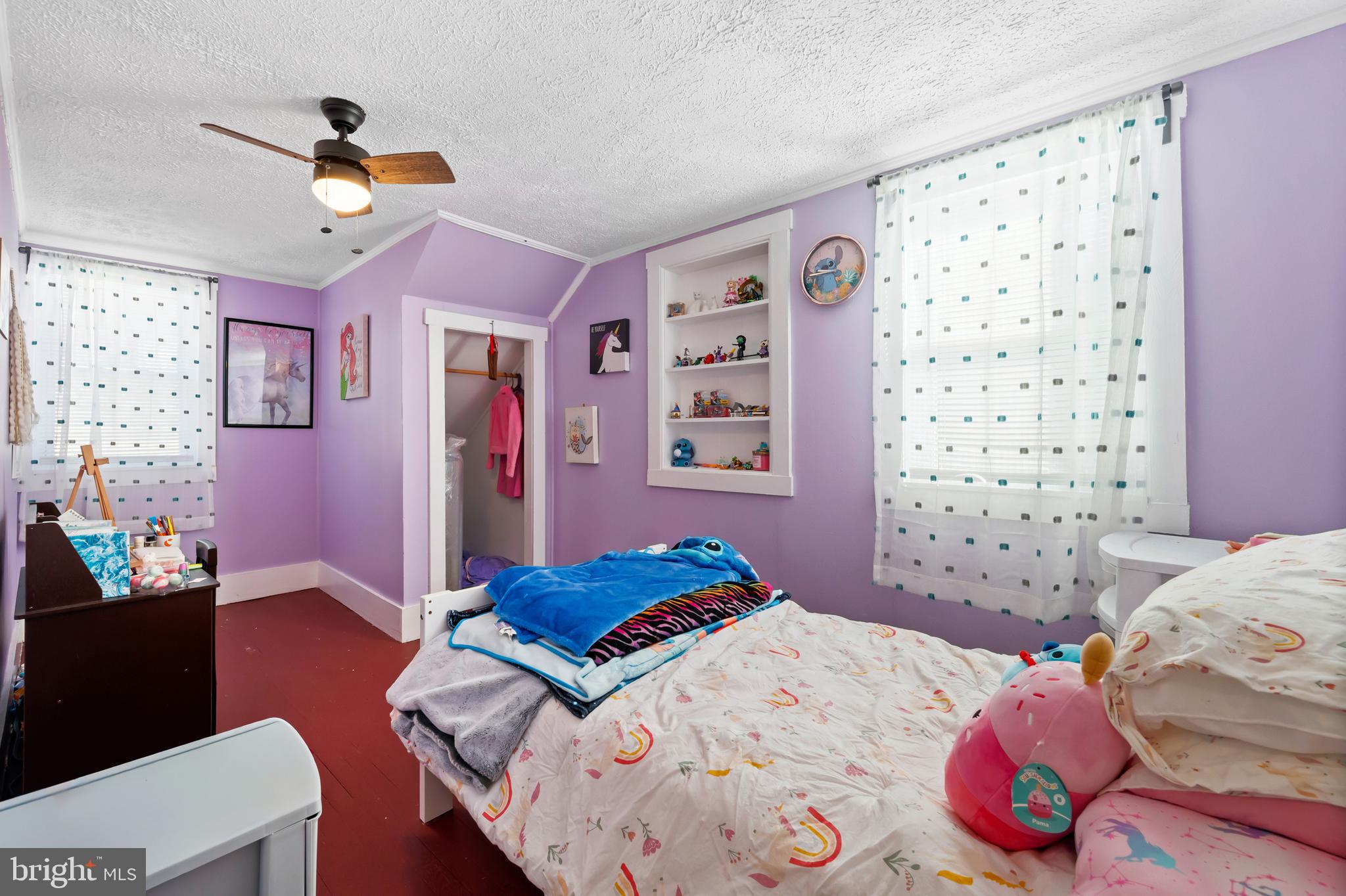 2906 Needmore Road Baker, WV 26801 - Photo 21 of 22 a bedroom that has a bed and a chandelier