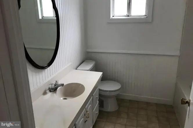 2906 Needmore Road Baker, WV 26801 - Photo 22 of 22 a bathroom with a sink and a mirror