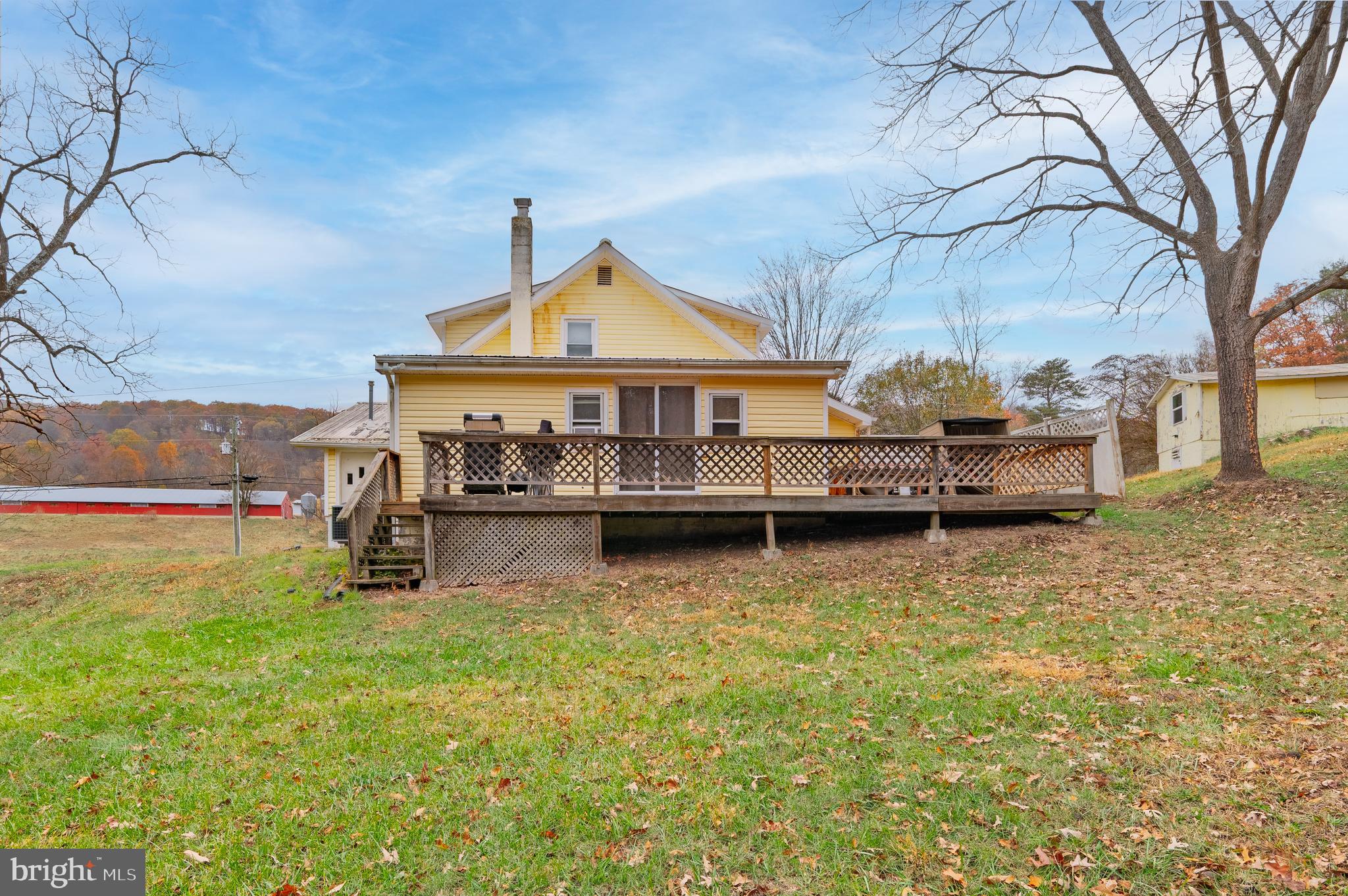 2906 Needmore Road Baker, WV 26801 - Photo 5 of 22 a view of pool with umbrella and wooden fence