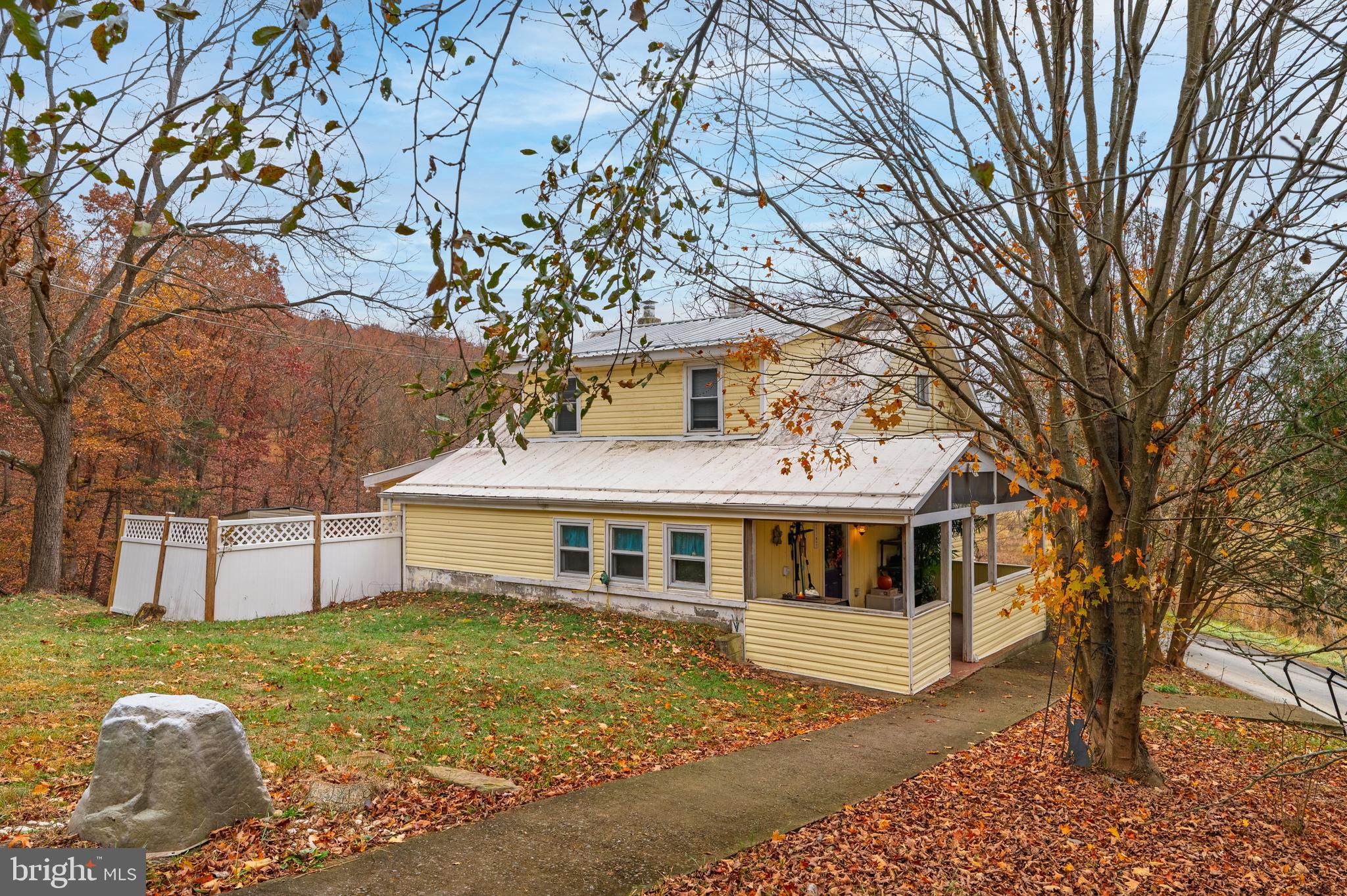 2906 Needmore Road Baker, WV 26801 - Photo 6 of 22 a front view of a house with garden