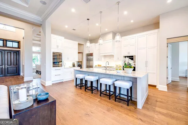 a living room with stainless steel appliances kitchen island granite countertop furniture and a kitchen view