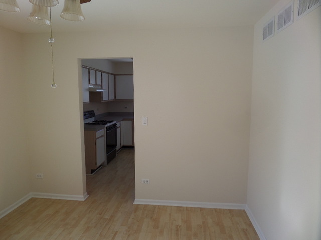 603 Buckboard Road Bolingbrook, IL 60490 - Photo 14 of 24 a view of a kitchen with a stove