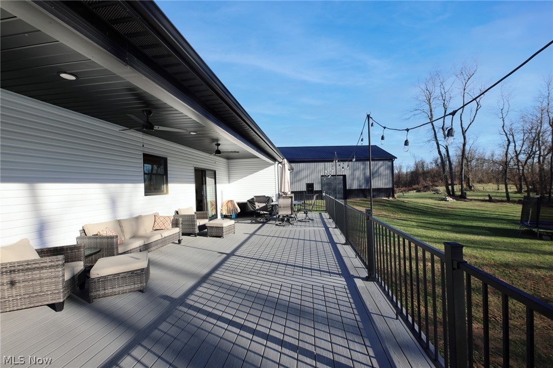 258 Friendly Acres Road Wellsburg, WV 26070 - Photo 32 of 47 Deck with ceiling fan and an outdoor hangout area